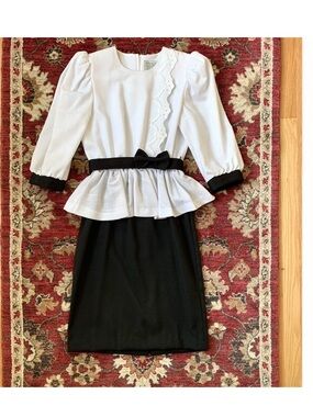 Vintage black and white dress with peplum skirt and bow